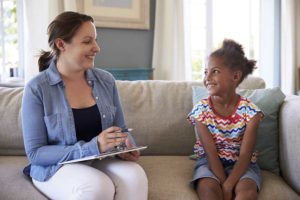 counselor with child working