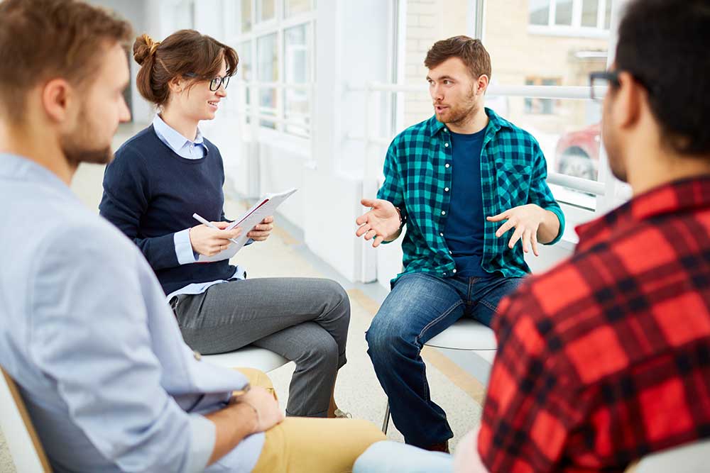 substance abuse counselor leading group therapy