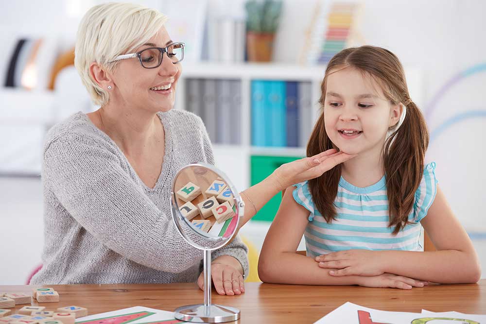 speech therapist working with a child